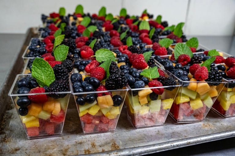 Fruit cups with fresh berries on top